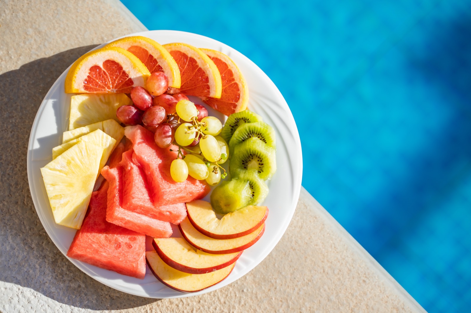 Fresh fruit plate at the edge of the pool
