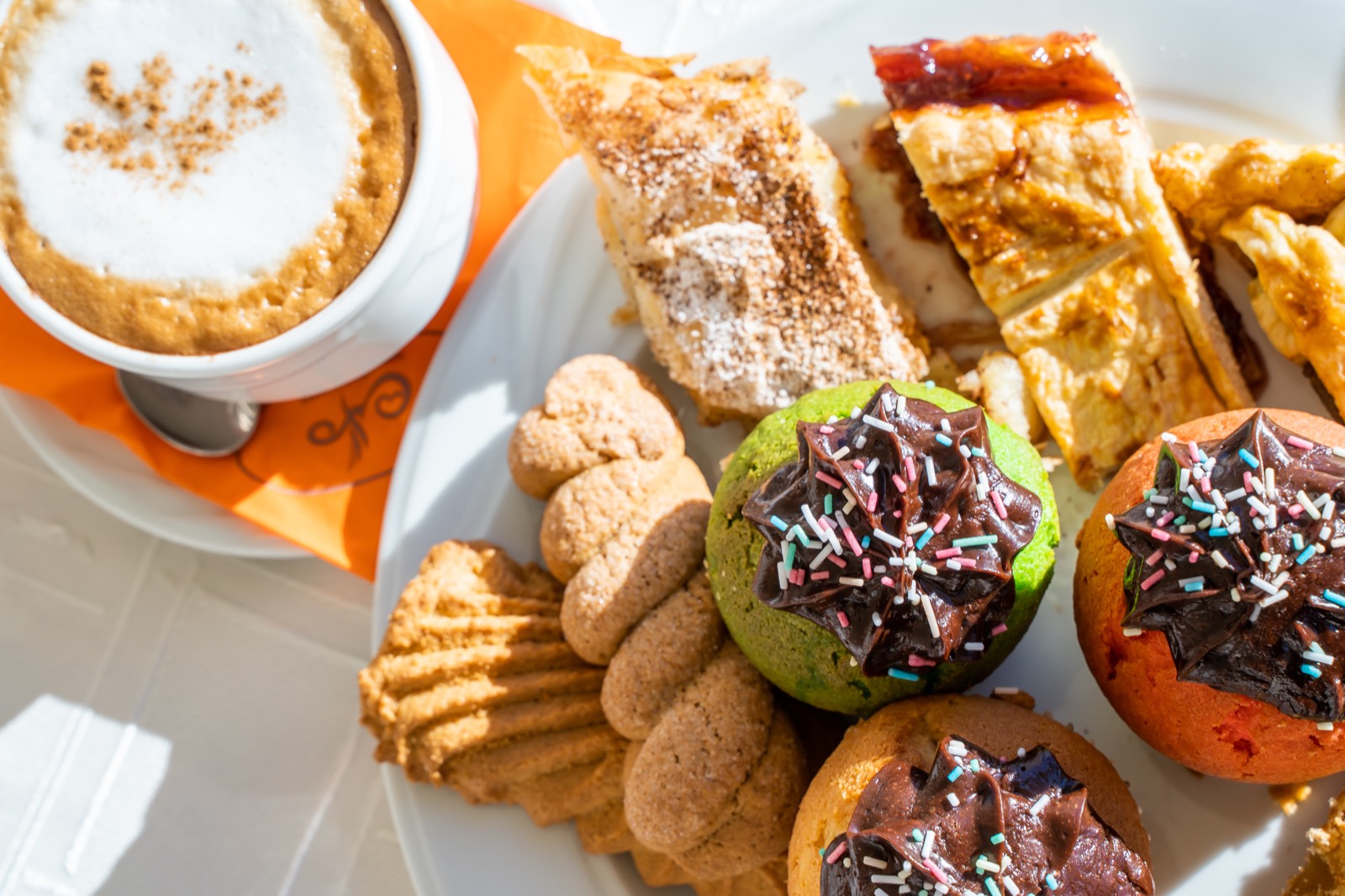 Cappuccino with homemade pastries and biscuits